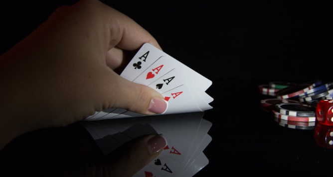 holding poker cards