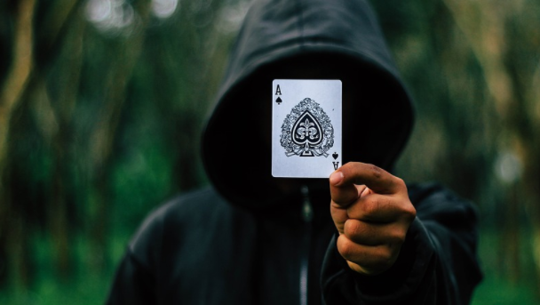 person holding a poker card